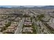 Aerial view showcasing home's location within neighborhood, highlighting streets and landscape at 1045 Via Camelia St, Henderson, NV 89011