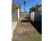 Backyard area featuring storage shed, gravel and block fence at 1108 Smith St, Las Vegas, NV 89108