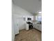 Bright, modern kitchen featuring white cabinets, new stainless steel appliances, and wood-style flooring at 1108 Smith St, Las Vegas, NV 89108