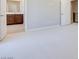 Spacious bedroom with plush carpeting and access to bathroom at 11904 Vector Ray Ave, Las Vegas, NV 89138