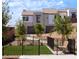 Fenced community dog park, complete with artificial turf and a bench, offers a secure space for pets at 11904 Vector Ray Ave, Las Vegas, NV 89138