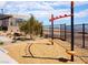 Outdoor exercise area in the community features modern fitness equipment and a wood chip ground covering at 11904 Vector Ray Ave, Las Vegas, NV 89138