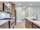 Modern kitchen with stainless steel appliances and island at 11904 Vector Ray Ave, Las Vegas, NV 89138