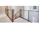 Modern staircase with metal railing, leading to upper level at 11904 Vector Ray Ave, Las Vegas, NV 89138