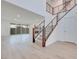 Bright and spacious entryway with modern staircase and wood flooring at 1225 Crimson Sunbird St, North Las Vegas, NV 89084