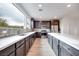 Modern kitchen with large island and stainless steel appliances at 1225 Crimson Sunbird St, North Las Vegas, NV 89084