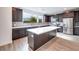 Modern kitchen with large island and stainless steel appliances at 1225 Crimson Sunbird St, North Las Vegas, NV 89084