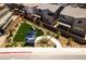 Aerial view of the community playground area, featuring green turf, shade and seating at 1225 Crimson Sunbird St, North Las Vegas, NV 89084