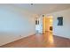 Bedroom with wood floors and access to bathroom and hallway at 1361 E University Ave # 209, Las Vegas, NV 89119