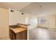 Kitchen with a breakfast bar, double sink, and view of living room at 1361 E University Ave # 209, Las Vegas, NV 89119