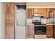 Stackable washer and dryer in a closet with wood paneling at 1361 E University Ave # 209, Las Vegas, NV 89119