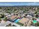 A view of a home and neighborhood that features a swimming pool and a large yard at 1420 S 8Th St, Las Vegas, NV 89104