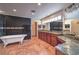 Elegant bathroom featuring dual sinks, marble countertops, and a clawfoot tub at 1420 S 8Th St, Las Vegas, NV 89104