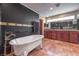 This luxurious bathroom includes dual vanities and a standalone clawfoot tub at 1420 S 8Th St, Las Vegas, NV 89104