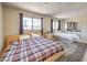 Spacious bedroom with two beds, natural light, and a mirrored closet for an airy feel at 1420 S 8Th St, Las Vegas, NV 89104