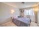 A simple bedroom featuring a bed, a window with curtains, and cozy decor at 1420 S 8Th St, Las Vegas, NV 89104