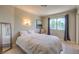 Cozy bedroom with natural light, neutral color scheme and comfortable furnishings at 1420 S 8Th St, Las Vegas, NV 89104