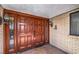 Double front door with sidelights, brick exterior, and decorative wall sconces at entryway at 1420 S 8Th St, Las Vegas, NV 89104