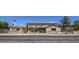 Two-story home with a gated entrance, desert landscaping, and a classic car parked in the driveway at 1420 S 8Th St, Las Vegas, NV 89104