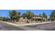 Landscaped home exterior with mature trees, secure brick-pillar fencing, and desert plants along the perimeter at 1420 S 8Th St, Las Vegas, NV 89104