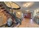 Elegant foyer with spiral staircase, water feature, and tiled floor, offering a grand entrance at 1420 S 8Th St, Las Vegas, NV 89104
