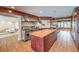 Gourmet kitchen featuring custom cabinetry, stainless steel appliances, and a center island with butcher block countertop at 1420 S 8Th St, Las Vegas, NV 89104