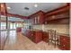 Custom kitchen with cherry wood cabinetry, granite countertops, and stainless steel appliances at 1420 S 8Th St, Las Vegas, NV 89104