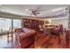 Elegant living room featuring hardwood floors, a wall of built-in bookshelves, and a cozy seating area at 1420 S 8Th St, Las Vegas, NV 89104