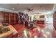 Large living area with hardwood floors, built-in bookshelves, and ample natural light at 1420 S 8Th St, Las Vegas, NV 89104