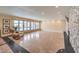 Living room features stone accent wall with fireplace, marble flooring, and sliding doors to pool area at 1420 S 8Th St, Las Vegas, NV 89104