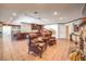 Open living room featuring a stone fireplace, wood accents, and access to an open-plan kitchen at 1420 S 8Th St, Las Vegas, NV 89104