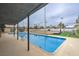 Covered pool area overlooking the expansive backyard, including a sports court and the Las Vegas skyline at 1420 S 8Th St, Las Vegas, NV 89104