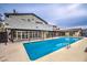 Backyard pool with a patio, surrounded by the home's exterior featuring a spiral staircase at 1420 S 8Th St, Las Vegas, NV 89104