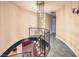 Elegant staircase with wrought iron railing and a decorative chandelier at 1420 S 8Th St, Las Vegas, NV 89104