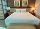 King size bed with room divider and artwork at 145 E Harmon Ave # 2306, Las Vegas, NV 89109