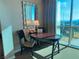 Small workspace with table, chairs, and city view at 145 E Harmon Ave # 2306, Las Vegas, NV 89109