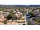 Wide angle shot shows a sprawling neighborhood surrounded by mountains at 1838 Country Meadows Dr, Henderson, NV 89012