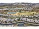 Aerial view of community with lake and golf course in the background at 19 Via Visione # 204, Henderson, NV 89011