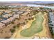 Aerial view of community near golf course and lake at 19 Via Visione # 204, Henderson, NV 89011