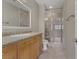Bathroom with wood cabinets and walk-in shower at 19 Via Visione # 204, Henderson, NV 89011