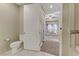 Bathroom with toilet and access to bedroom and additional bath at 19 Via Visione # 204, Henderson, NV 89011