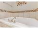Soaking tub with modern fixtures and tile surround at 19 Via Visione # 204, Henderson, NV 89011