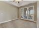 Spacious bedroom with carpeted floor and sliding glass doors to balcony at 19 Via Visione # 204, Henderson, NV 89011