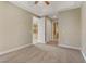 Bright bedroom featuring plush carpeting and views of kitchen and bath at 19 Via Visione # 204, Henderson, NV 89011