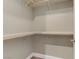 Walk-in closet with built in shelves and hanging rods at 19 Via Visione # 204, Henderson, NV 89011