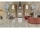 Grand lobby with high ceilings, chandelier, and comfortable seating at 19 Via Visione # 204, Henderson, NV 89011