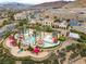 Community pool and spa area with landscaping and mountain views at 19 Via Visione # 204, Henderson, NV 89011