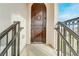 Dark wood entry door with decorative hardware, leading into the home at 19 Via Visione # 204, Henderson, NV 89011