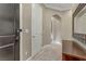 Bright and spacious entryway with tile flooring and a console table at 19 Via Visione # 204, Henderson, NV 89011