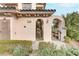 Townhome entry with gated access and exterior stairs leading to the unit at 19 Via Visione # 204, Henderson, NV 89011